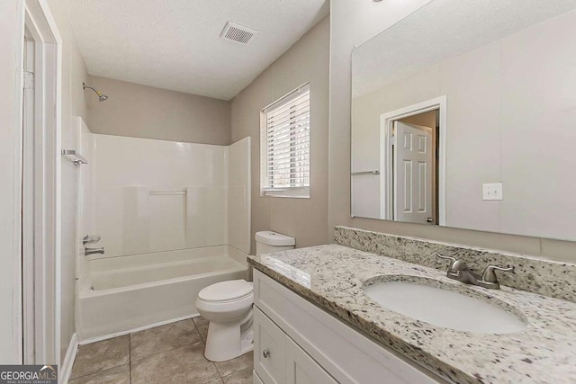 bathroom featuring visible vents, toilet, a textured ceiling, tile patterned flooring, and vanity