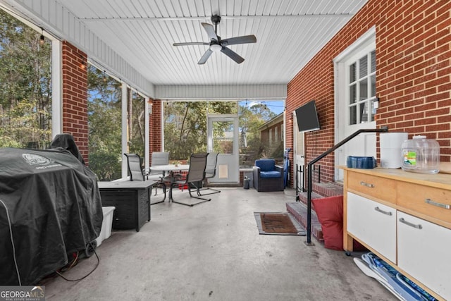 view of patio featuring area for grilling and a ceiling fan