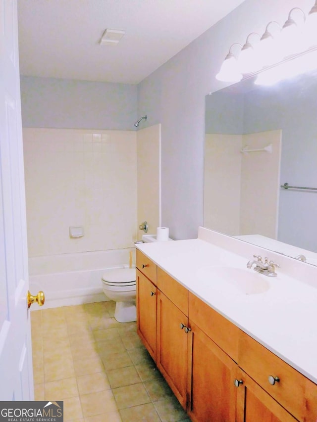 bathroom featuring tile patterned flooring, toilet, vanity, and shower / bathtub combination