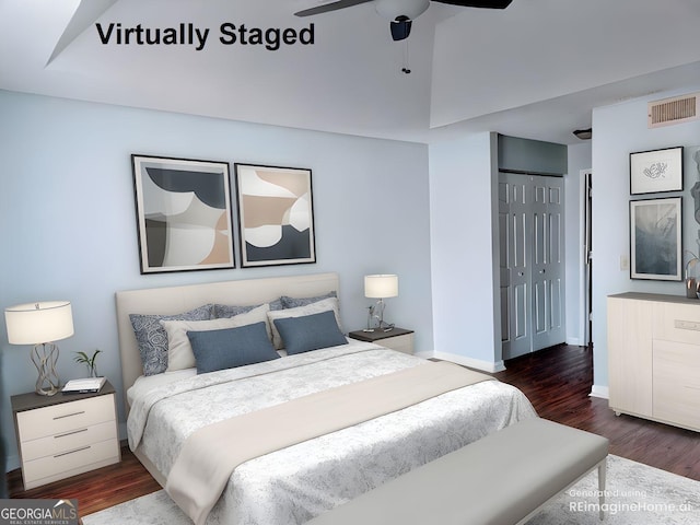 bedroom featuring visible vents, baseboards, wood finished floors, a closet, and a ceiling fan