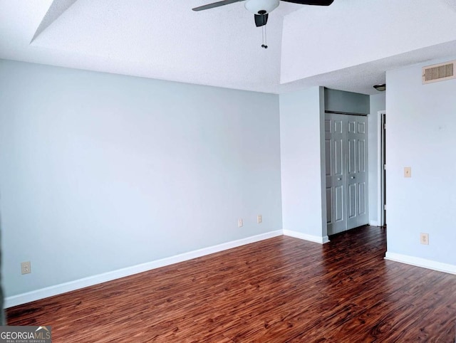 interior space featuring wood finished floors, visible vents, baseboards, ceiling fan, and a closet