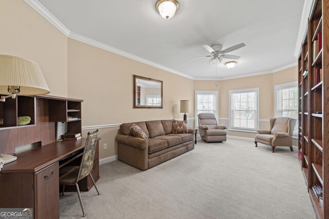 home office with crown molding, light colored carpet, and ceiling fan