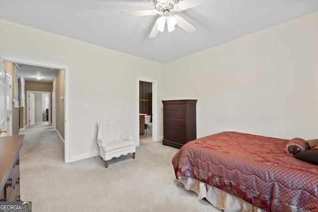 bedroom with light carpet, ceiling fan, connected bathroom, and baseboards