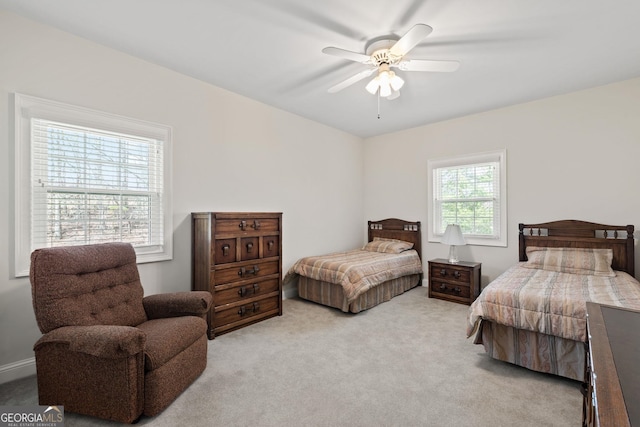 carpeted bedroom featuring a ceiling fan