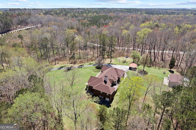 bird's eye view featuring a forest view