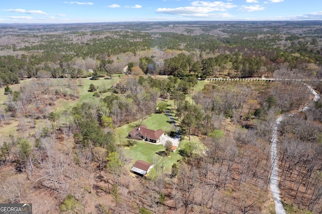 bird's eye view featuring a view of trees