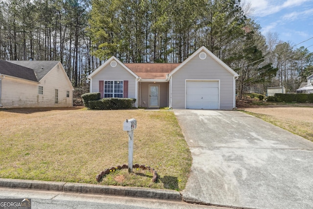 ranch-style home featuring concrete driveway, an attached garage, and a front lawn