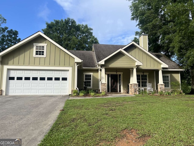 10390 Rivertown Rd, Fairburn, GA 30213 - craftsman-style house with board and batten siding, a chimney, covered porch, driveway, and a front yard