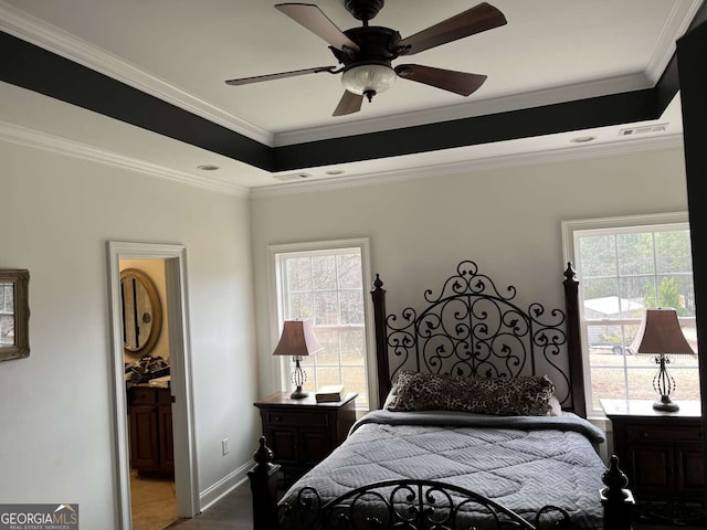 10390 Rivertown Rd, Fairburn, GA 30213 - bedroom featuring multiple windows, crown molding, baseboards, ensuite bathroom, and a tray ceiling