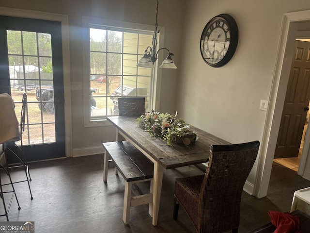 10390 Rivertown Rd, Fairburn, GA 30213 - dining space with baseboards and dark wood-style floors