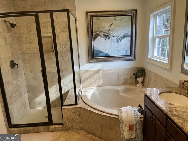 10390 Rivertown Rd, Fairburn, GA 30213 - full bathroom with a shower stall, a bath, and vanity