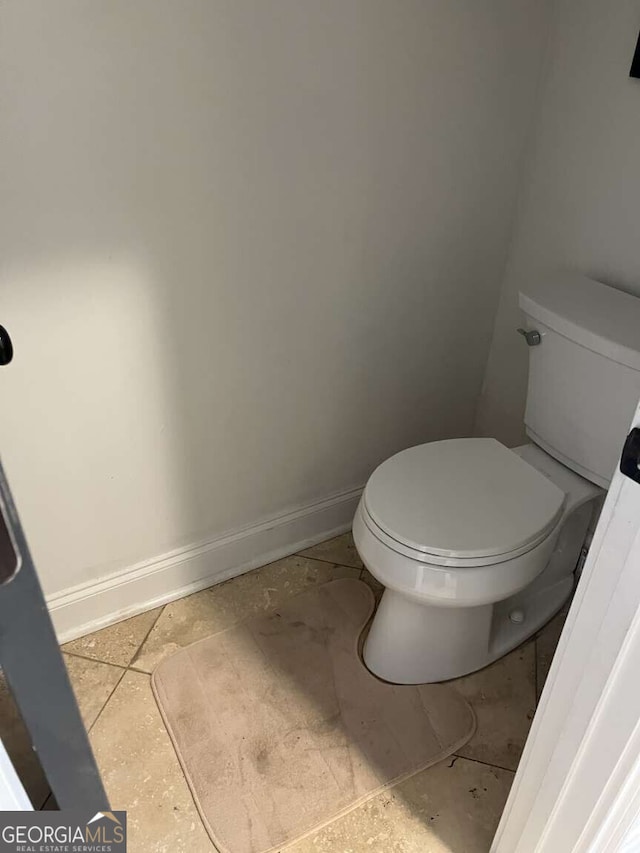 10390 Rivertown Rd, Fairburn, GA 30213 - bathroom with toilet and baseboards