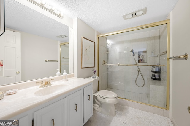 3530 Piedmont Rd NE Unit 3I, Atlanta, GA 30305 - bathroom featuring vanity, a stall shower, tile patterned flooring, and a textured ceiling