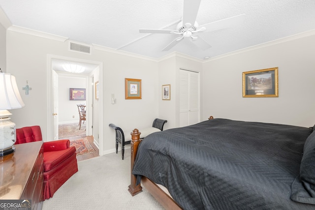 3530 Piedmont Rd NE Unit 3I, Atlanta, GA 30305 - bedroom featuring crown molding, light colored carpet, a closet, a ceiling fan, and a textured ceiling