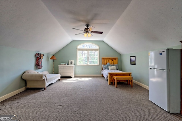 1068 Coleman River Rd, Clayton, GA 30525 - bedroom featuring freestanding refrigerator, carpet flooring, vaulted ceiling, baseboards, and a textured ceiling