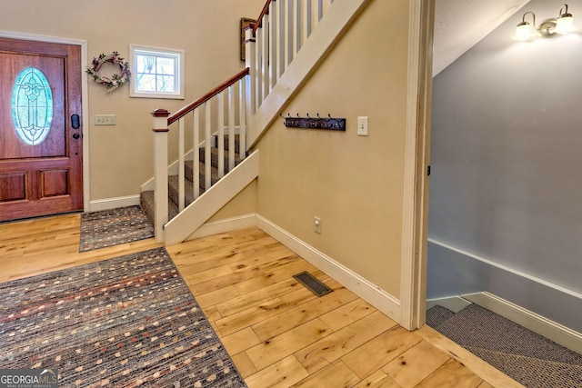 1068 Coleman River Rd, Clayton, GA 30525 - entryway with baseboards, stairway, and wood finished floors