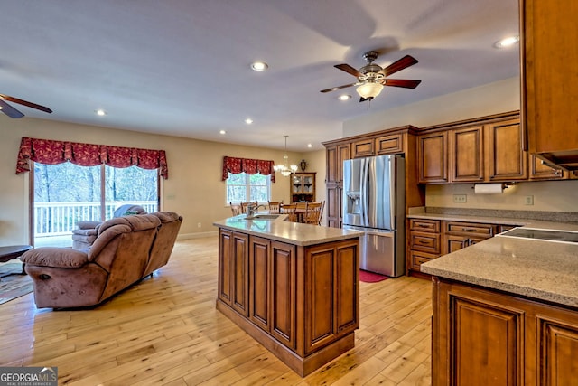 1068 Coleman River Rd, Clayton, GA 30525 - kitchen with stainless steel fridge with ice dispenser, ceiling fan, brown cabinets, open floor plan, and recessed lighting