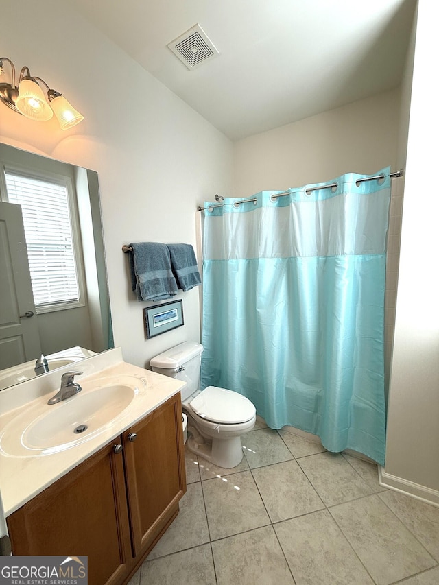 bathroom featuring vanity, a shower with curtain, visible vents, tile patterned flooring, and toilet
