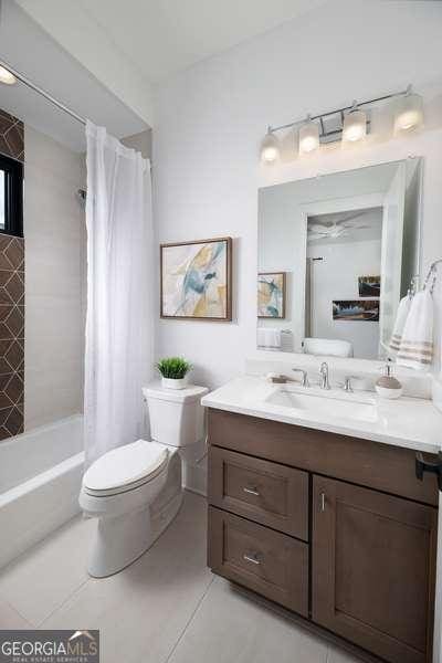 full bath featuring tile patterned floors, toilet, and vanity