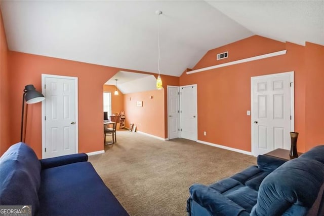 living room with vaulted ceiling, baseboards, visible vents, and carpet floors