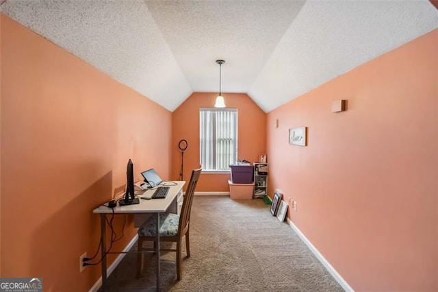 office space featuring carpet flooring, a textured ceiling, baseboards, and vaulted ceiling