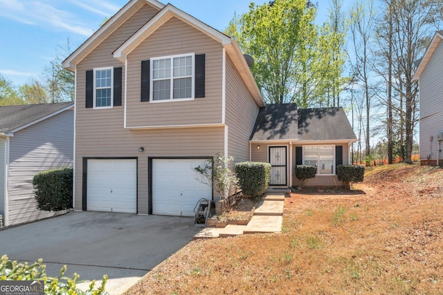 view of front of home with driveway and a garage