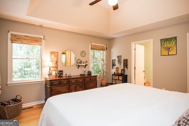 1041 Oconee Forest Ln, Watkinsville, GA 30677 - bedroom with wood finished floors, baseboards, ceiling fan, and ensuite bath