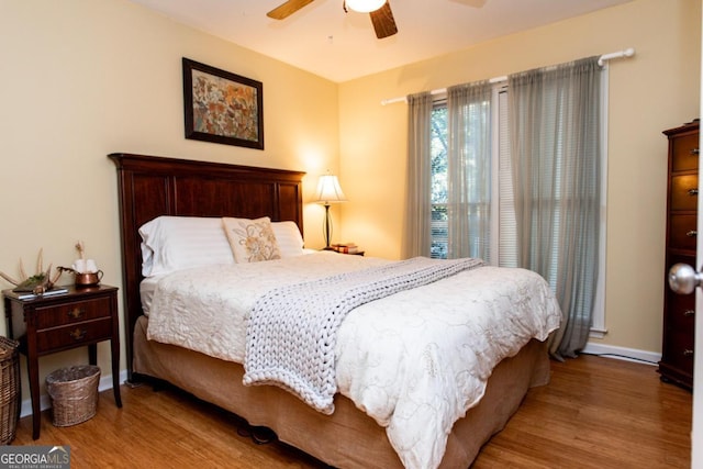 1041 Oconee Forest Ln, Watkinsville, GA 30677 - bedroom with wood finished floors, baseboards, and ceiling fan