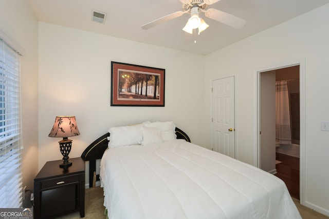 carpeted bedroom with visible vents and ceiling fan