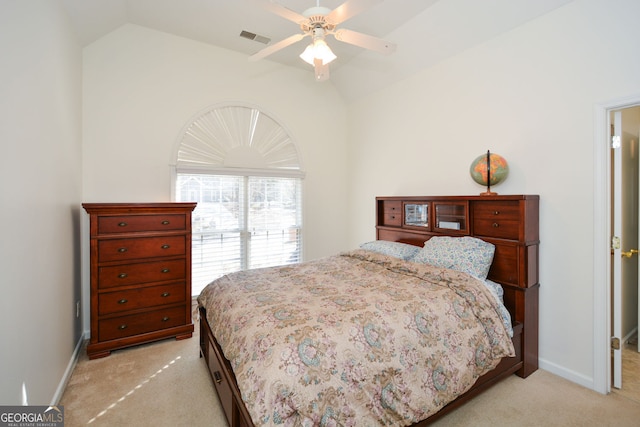 bedroom with baseboards, visible vents, lofted ceiling, and light carpet
