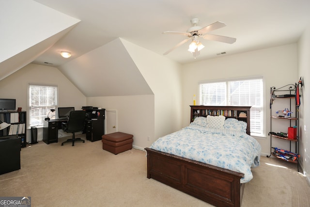 bedroom with a ceiling fan, visible vents, baseboards, lofted ceiling, and light colored carpet