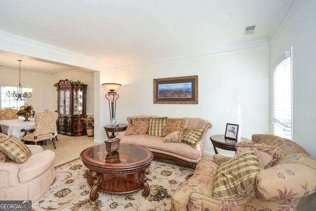 305 Collegiate Dr, Powder Springs, GA 30127 - living area featuring ornamental molding, a chandelier, plenty of natural light, and carpet flooring