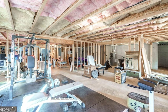 unfinished below grade area featuring water heater