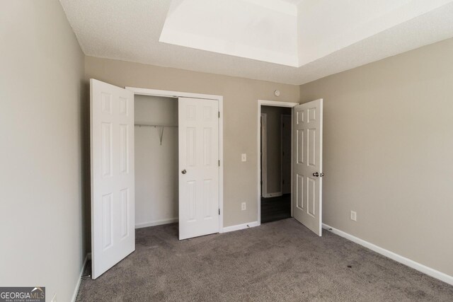 5345 Bridle Point Pkwy, Snellville, GA 30039 - unfurnished bedroom featuring a closet, carpet flooring, and baseboards