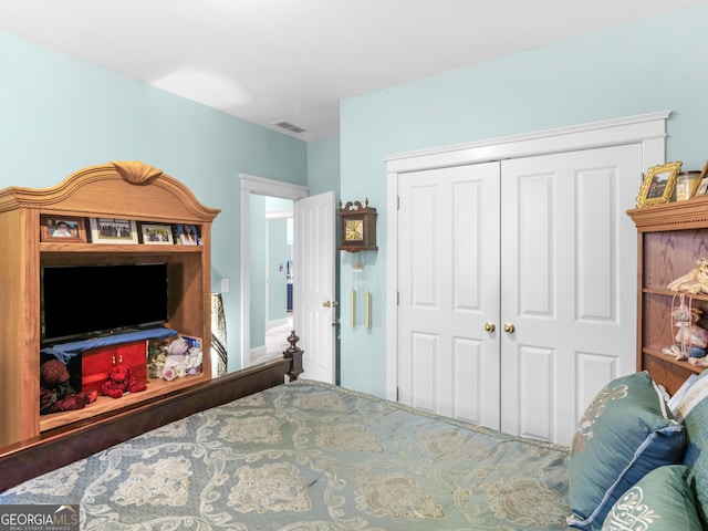 bedroom featuring a closet and visible vents