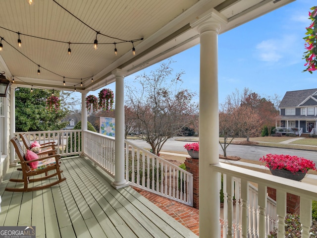 wooden terrace with a porch