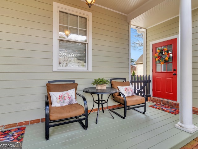 view of exterior entry with covered porch