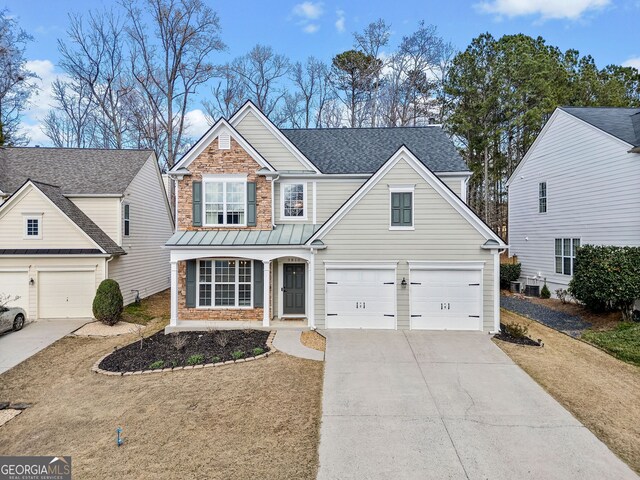 3810 Branch Bluff Ln, Cumming, GA 30040 - traditional home with stone siding, an attached garage, roof with shingles, and driveway