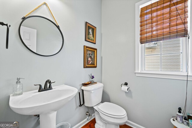 3810 Branch Bluff Ln, Cumming, GA 30040 - half bath featuring toilet, baseboards, and a sink