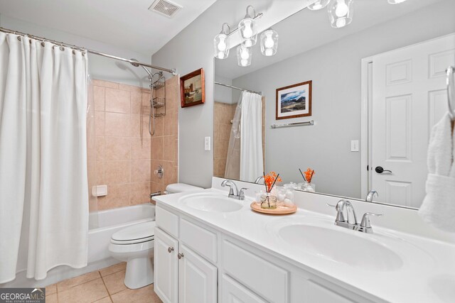 3810 Branch Bluff Ln, Cumming, GA 30040 - bathroom featuring tile patterned flooring, toilet, visible vents, and a sink