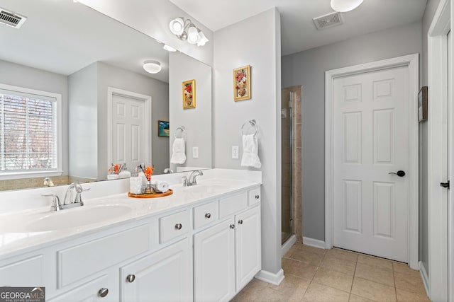 3810 Branch Bluff Ln, Cumming, GA 30040 - bathroom featuring tile patterned flooring, visible vents, and a sink