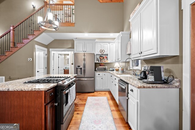 153 Whistle Pig Ter, Blairsville, GA 30512 - kitchen with a sink, light wood-style floors, appliances with stainless steel finishes, and white cabinets