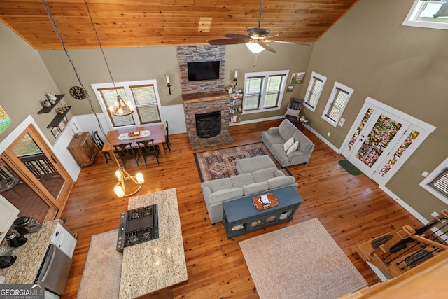 153 Whistle Pig Ter, Blairsville, GA 30512 - living area featuring light wood-style floors, high vaulted ceiling, a stone fireplace, and wooden ceiling