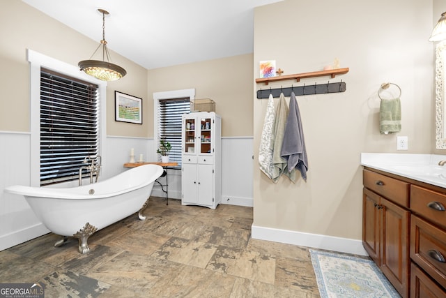 153 Whistle Pig Ter, Blairsville, GA 30512 - full bathroom featuring a freestanding tub, vanity, wainscoting, and stone finish floor