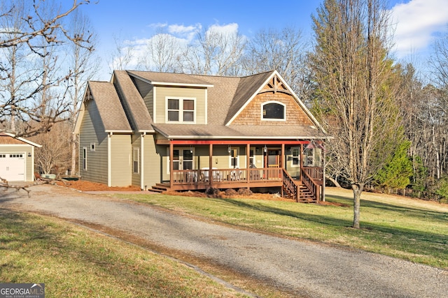 153 Whistle Pig Ter, Blairsville, GA 30512 - view of front of home with an outbuilding, a porch, a shingled roof, a front lawn, and aphalt driveway
