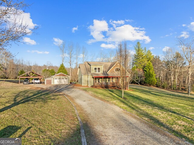 153 Whistle Pig Ter, Blairsville, GA 30512 - view of front facade featuring driveway, a porch, a front lawn, a carport, and an outdoor structure