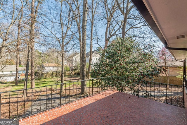 view of patio / terrace featuring visible vents and fence