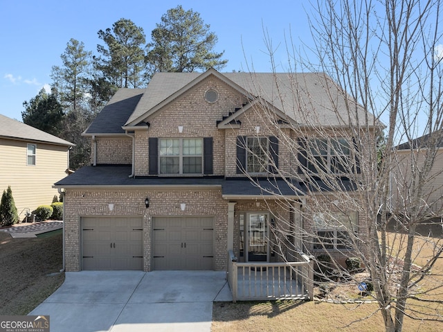 view of front of house featuring concrete driveway, brick siding, and roof with shingles