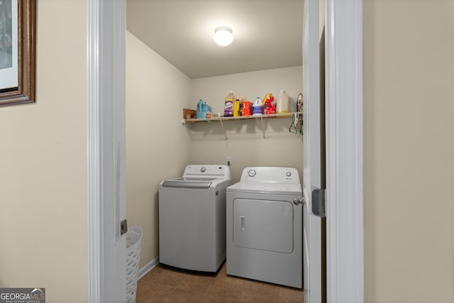 clothes washing area featuring washer and dryer and laundry area