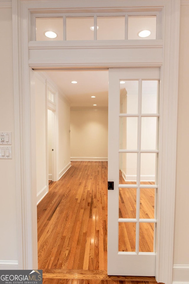 corridor with recessed lighting and light wood-style floors